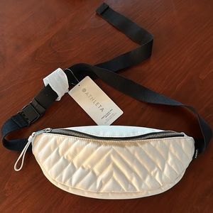 NWT Kinetic Waist bag. Satiny Off white coloring. Waist or cross front.